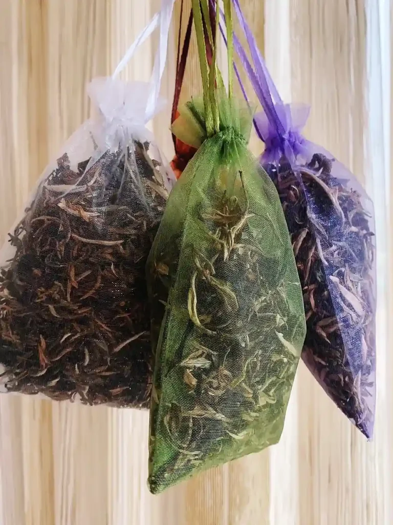 Sprinkling dried tea leaves on a carpet to remove odors.