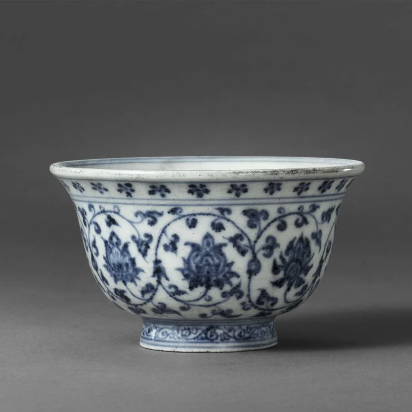 The Yongle period (1403–1424) blue-and-white floral-scroll-patterned hand-held cup from the Ming Dynasty, collected by the Palace Museum